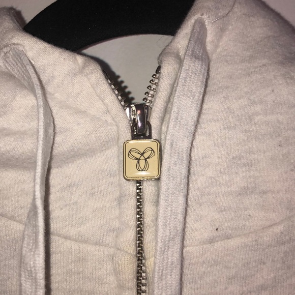 Very light grey TNA zip up with light purple logo - Picture 4 of 11